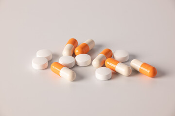 Tablets, medications on a white background, a scattering of tablets