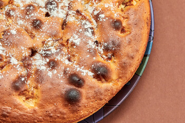 Homemade apple pie on a brown background