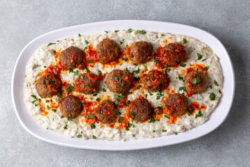 Traditional Turkish food; Meatballs on eggplant puree prepared with yogurt. local name; Alinazik kebab. Turkish name; Kofteli Alinazik kebabi - begendili kofte