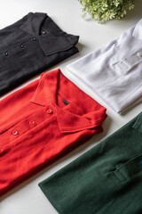 A collection of polo shirts photographed on a white mat.