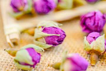 Many naturally dried rose buds on the table