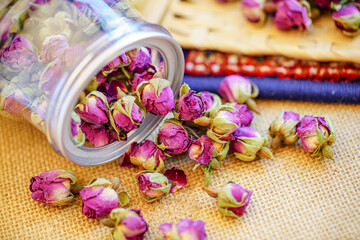 Many naturally dried rose buds on the table