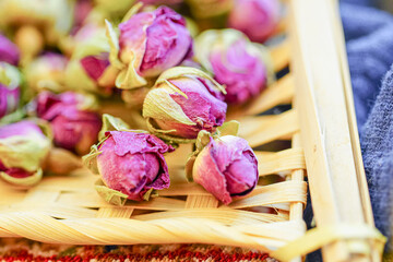 Many naturally dried rose buds on the table