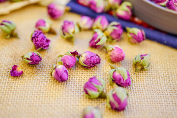 Many naturally dried rose buds on the table