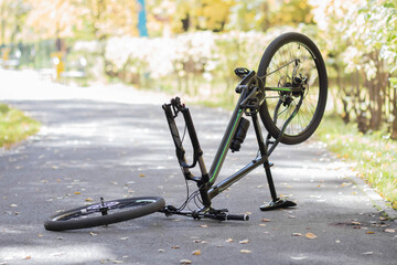 A broken bicycle in the park. Close up
