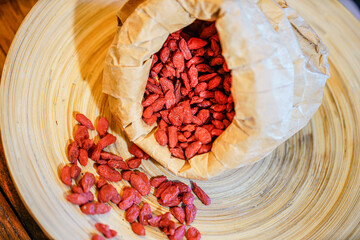 There are many naturally dried red wolfberries on the table