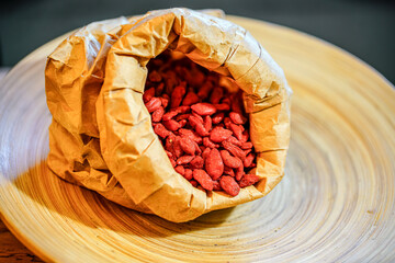 There are many naturally dried red wolfberries on the table