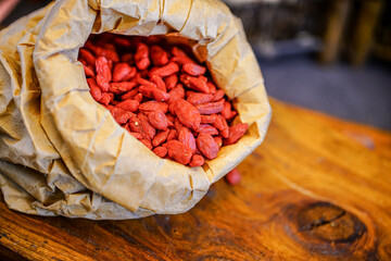 There are many naturally dried red wolfberries on the table