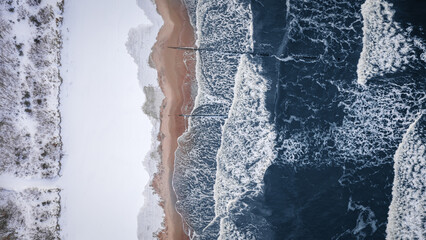Snowy beach at Baltic sea in winter. Tourism in Poland. - obrazy, fototapety, plakaty