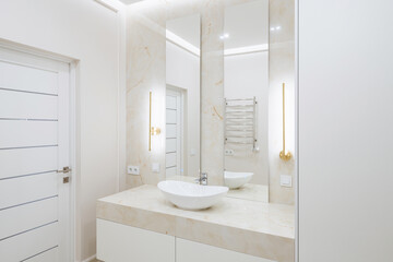 Fototapeta na wymiar bathroom interior design with light tiles and glass shower