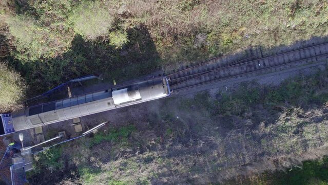 Cargo Train Bird's Eye View Departing a Station