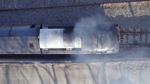 Locomotive Cargo Train Bird's Eye View Departing a Station