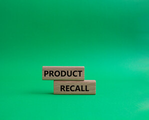 Product recall symbol. Concept words Product recall on wooden blocks. Beautiful green background. Business and Product recall concept. Copy space.