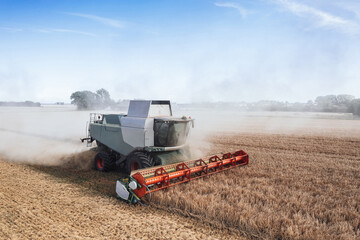 Combine harvester in a wheat field