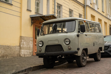 Fototapeta na wymiar restyled retro uaz bus nicknamed bukhanka parked in the street