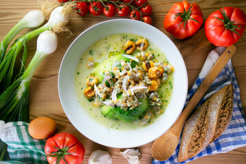 Cockles ceviche with avocado, red onion and puffed corn. Traditional recipe from Peru.