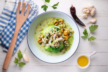 Cockles ceviche with avocado, red onion and puffed corn. Traditional recipe from Peru.