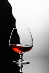 Splash of brandy in a snifter glass.