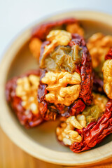 Studio shooting walnut kernels and red dates