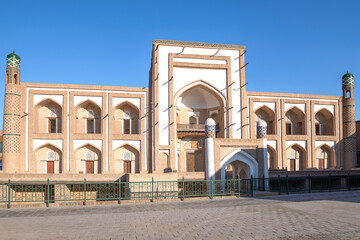 Fototapeta na wymiar Ancient madrasah of Amir-Tour on a sunny day. Khiva, Uzbekistan