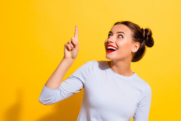 Photo of amazed positive lady point empty space incredible offer discount isolated bright color...