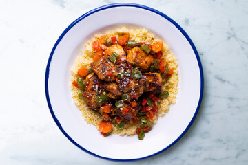 Marinated chicken with vegetables and couscous. Traditional African recipe.