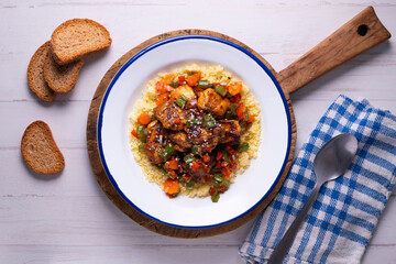 Marinated chicken with vegetables and couscous. Traditional African recipe.