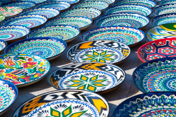 Colorful plates with traditional national patterns close up. Uzbekistan