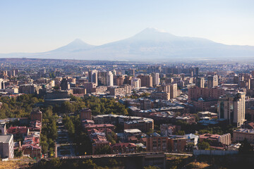 Yerevan, Armenia, beautiful super-wide angle panoramic view of Yerevan with Mount Ararat, cascade complex, mountains and scenery beyond the city, summer sunny day