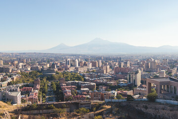 Yerevan, Armenia, beautiful super-wide angle panoramic view of Yerevan with Mount Ararat, cascade complex, mountains and scenery beyond the city, summer sunny day
