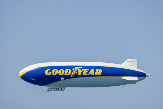 Bodensee, Germany - July 22, 2022: Side view of the Goodyear Blimp zeppelin flying over the Bodensee in Germany and Austria. 