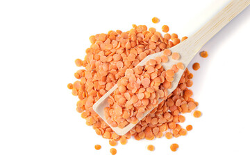 Red Lentils (Red Masoor, masoor Dal). Red Lentils with wooden spoon on white background