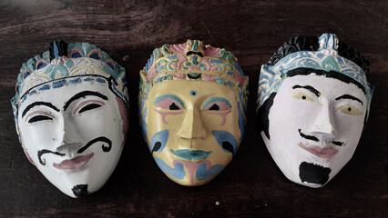 Indonesian traditional mask art with dark background