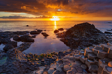 sunset over the sea at Gaint´s Causeway in Ireland