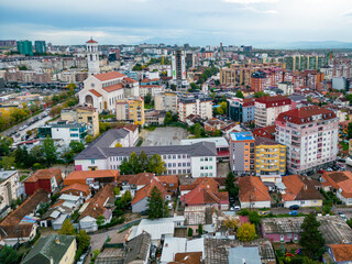 Fototapeta na wymiar Pristina Modern City Center and Residential Buildings. Aerial View over Capital of Kosovo. Balkans. Europe. 