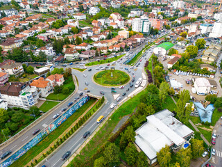 Fototapeta na wymiar Pristina Modern City Center and Residential Buildings. Aerial View over Capital of Kosovo. Balkans. Europe. 