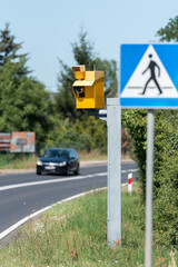 speed camera and pedestrian crossing road sign