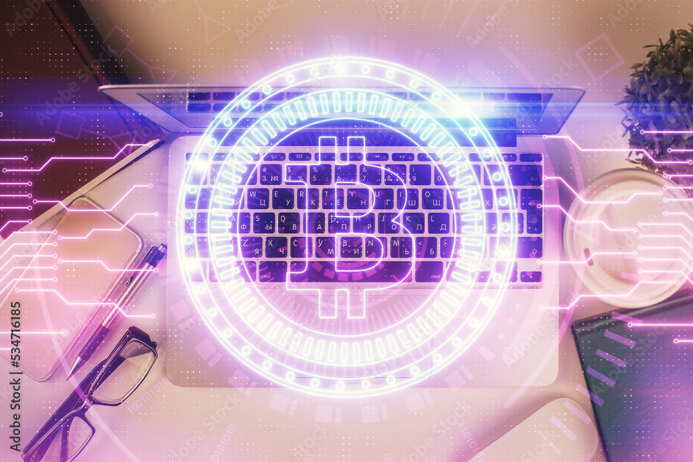 Poster Blockchain theme hologram drawings over computer on the desktop background. Top view. Double exposure.