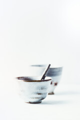 Traditional, handcrafted ceramic on bright background. Soft focus. Copy space.	