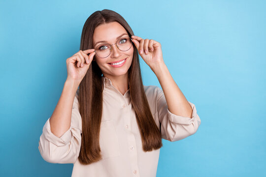 Photo of nice young lady wear eyewear grey shirt isolated on blue color background