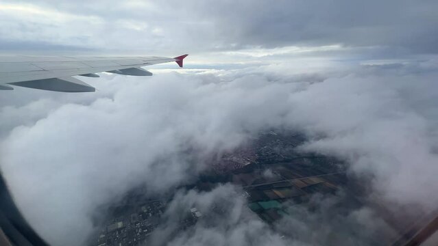 beautiful cloudscape over europe and plane wing