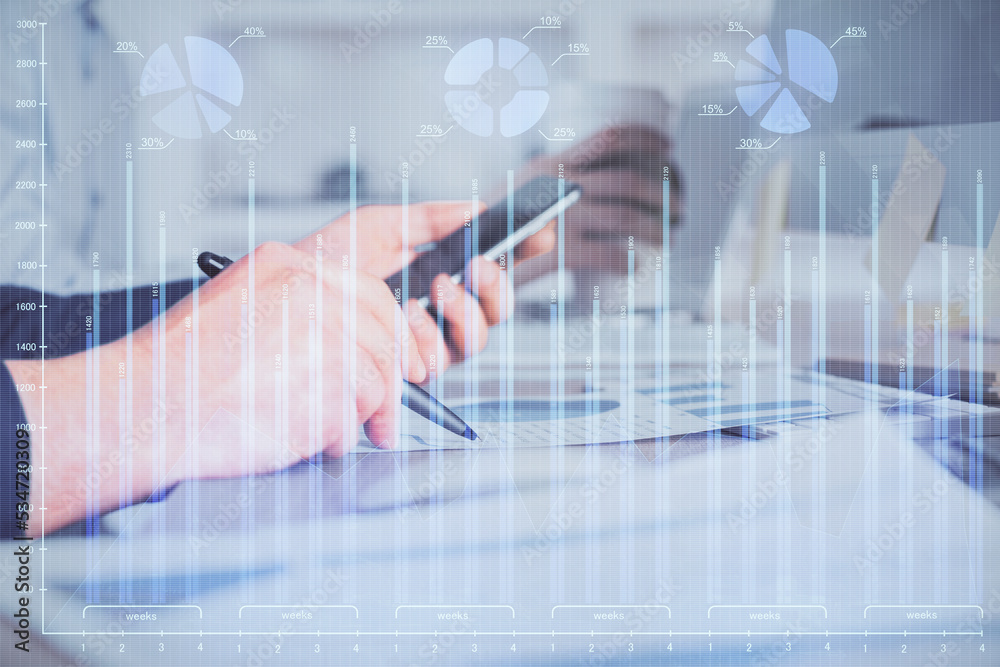 Poster double exposure of man's hands holding and using a phone and financial chart drawing. market analysi