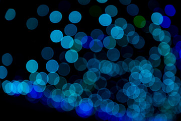Blue Defocus Abstract bokeh light effects on the night black background texture