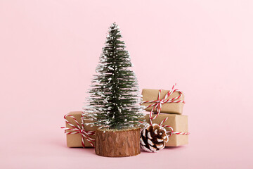 Christmas composition. Gifts, small tree, branches and craft DIY decorations on white background. New year concept. Christmas home decoration Flat lay, top view, copy space