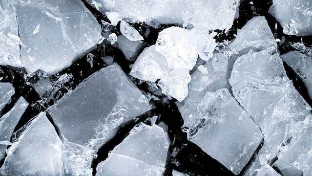 Abstract ice texture. A network of cracks on a piece of blue ice