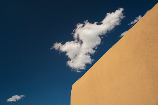 Usa, New Mexico, Santa Fe, Low angle view of clouds over adobe wall