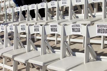 Rows of VIP chairs set up for media