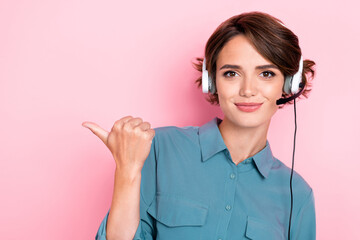 Photo portrait of pretty young lady point empty space call center assistant dressed trendy blue...