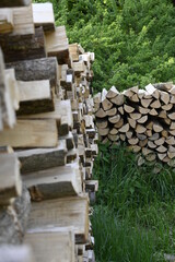 Zwei Brennholz Stapel vor einem Wald in Rheinland-Pfalz Deutschland