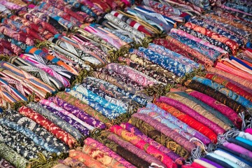 Lao Silk scarf at Night Market at Lunag Prabang with Wat May Souvannapoumaram in the background, Laos PDR High quality photo